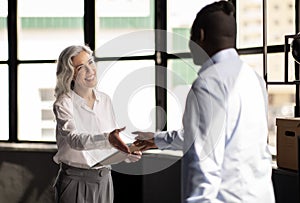 HR Manager Woman Shaking Hands With Job Applicant In Office