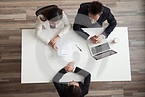 Hr managers interviewing female job applicant, top view from abo