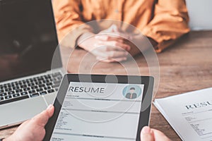 HR managers are interviewing job applicants who fill out their resume on the job application form in order to consider accepting a