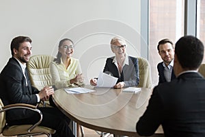 Hr managers laugh at joke of applicant at job interview photo