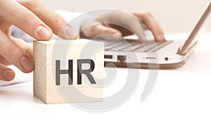 HR text wooden block on white table background. Idea, strategy, advertising, marketing, keyword and content concept