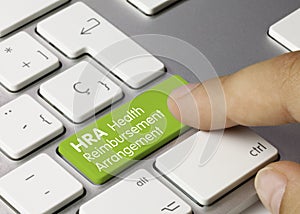 HRA Health Reimbursement Arrangement - Inscription on Green Keyboard Key
