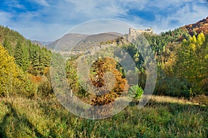 Hrad Sasov castle ruins near Hron river during autumn