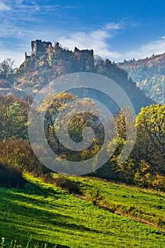 Hrad Sasov castle ruins near Hron river during autumn