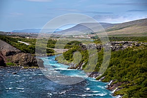 Hraunfossar series of waterfalls formed by rivulets streaming over a distance of about 900 metres