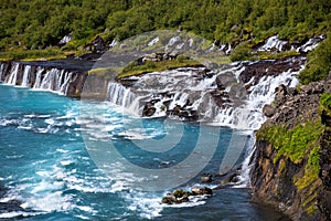 Hraunfossar series of waterfalls formed by rivulets streaming over a distance of about 900 metres