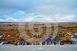 Hraunfossar Waterfalls in Iceland are a breathtaking natural wonder that are particularly stunning during the spring season.