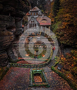 Hresko, Czech Republic - Aerial view of a lovely stone cottage in the Czech woods near Hresko at autumn with colorful fall foliage