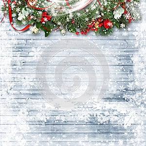 Ð¡hristmas background. Wooden snow background with fir branches and red berries