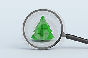 Ð¡hristmas tree behind magnifying glass