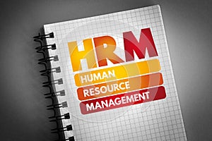 HRM - Human Resource Management acronym on notepad, business concept background photo
