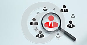 HRM or Human Resource Management, Magnifier glass focus on manager icon, one of employee icons for leadership recruitment