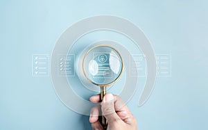 HRM or Human Resource Management, Magnifying glass focus to resume icon