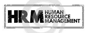 HRM - Human Resource Management is the strategic approach to the effective and efficient management of people in a company or photo