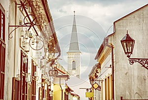 Hrnciarska street with Calvinist church in Kosice, yellow filter