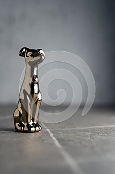 Ð¡hrome-plated metal statuette of a dog