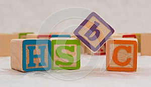 HSBC phrase written with kids cubes photo