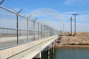 Border Canal between United States and Mexico photo