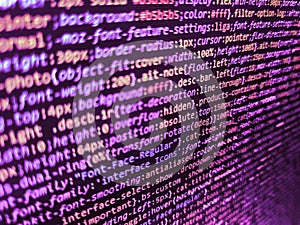 HTML code on lcd screen. Modern web development background. Shallow depth of field, selective focus effect. Internet connection