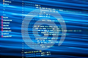 HTML and CSS code and colorful light effects.