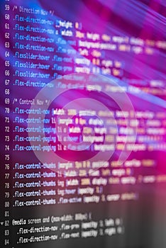 HTML and CSS code and colorful light effects.