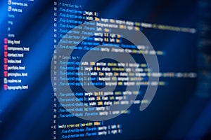 HTML and CSS code and colorful light effects.