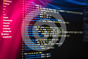 HTML and CSS code and colorful light effects.