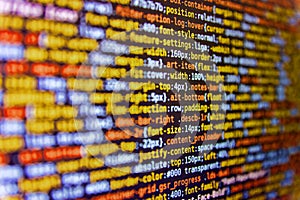 HTML and CSS code developing screenshot. Coding programmer abstract background. Web developer HTML code with CSS on screen.