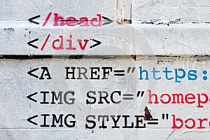 HTML stencil graffiti on brick wall