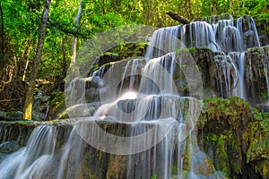 Huai Lao Waterfall in rain forest at Loei Province in Thailand , Soft focus