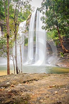 Huai Luang Waterfall, also known as Namtok Huai Luang or Namtok Bak Teo. The waterfall is plunging down three steps from an elevat