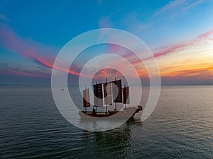 Huaian, Jiangsu: Sailing boats on Hongze Lake in an epic sunset