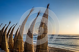 Huanchaco Beach and the traditional reed boats & x28;caballitos de totora& x29; - Trujillo, Peru photo