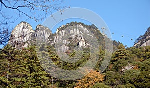 Huangshan Mountain in Anhui Province, China. Beautiful mountain scenery with trees and Yungu Cable Car