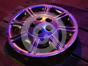 Hubcap under colored lights
