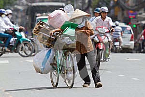 HUE, VIETNAM - JULY 25. Vietnamese woman packed her possesions o