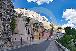 Huecar street in the city of Cuenca with its traditional white houses, Spain photo