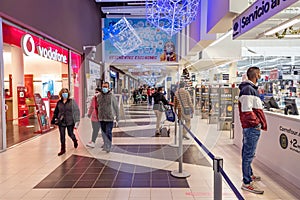 Huelva, Spain - December 5, 2020: Inside Carrefour hypermarket at Holea Shopping center. Long exposure Photography and People