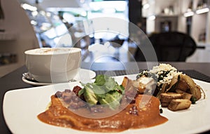 Huevos rancheros with coffee photo