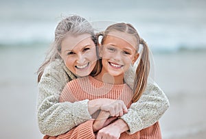 Hug, beach and portrait of girl and grandma on vacation, holiday or trip. Family love, care and happy grandmother