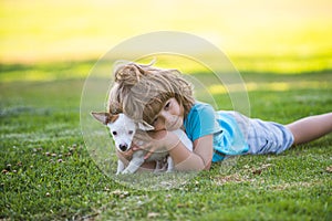 Hug dog friends. Child with puppies doggy kissing and hugging.