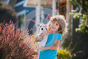 Hug friends. Best friend child and puppy have fun on vacation.