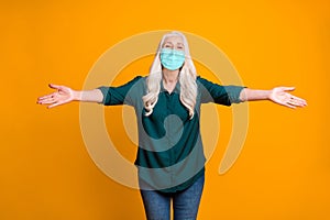 Hug me Photo of grandma spread open arms wear mask green shirt jeans isolated vivid yellow color background