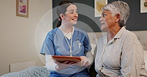 Hug, tablet and nurse with senior woman in bedroom for medical wellness consultation with help. Comfort, healthcare and