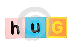 Hug in toy play block letters on white