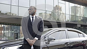 Huge Afro-American security chief monitoring order outside business center