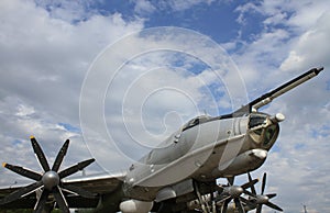 Huge Antenna On Landed Soviet Strategic Bomber Nose With Clouds On Blue Sky Background