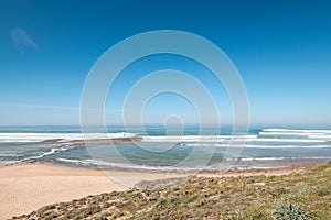 Huge beach Praia do Farol u mÃâºsta Vila Nova de Milfontes in the Odemira region, western Portugal photo