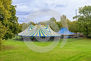 Huge big blue top circus tent built on green grass, Brussels, Belgium