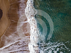 Huge big waves from above at the Island of Sicily, drone view at beach and huge waves